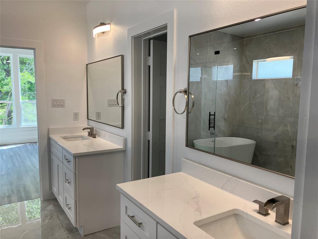 42101 Crooked Stick Drive Whitney, TX 76692 - Photo 15 of 27 a bathroom with a sink a toilet and shower