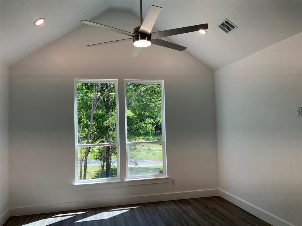 42101 Crooked Stick Drive Whitney, TX 76692 - Photo 17 of 27 a view of an empty room with wooden floor and a window