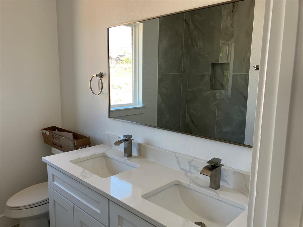 42101 Crooked Stick Drive Whitney, TX 76692 - Photo 18 of 27 a bathroom with a sink and a toilet