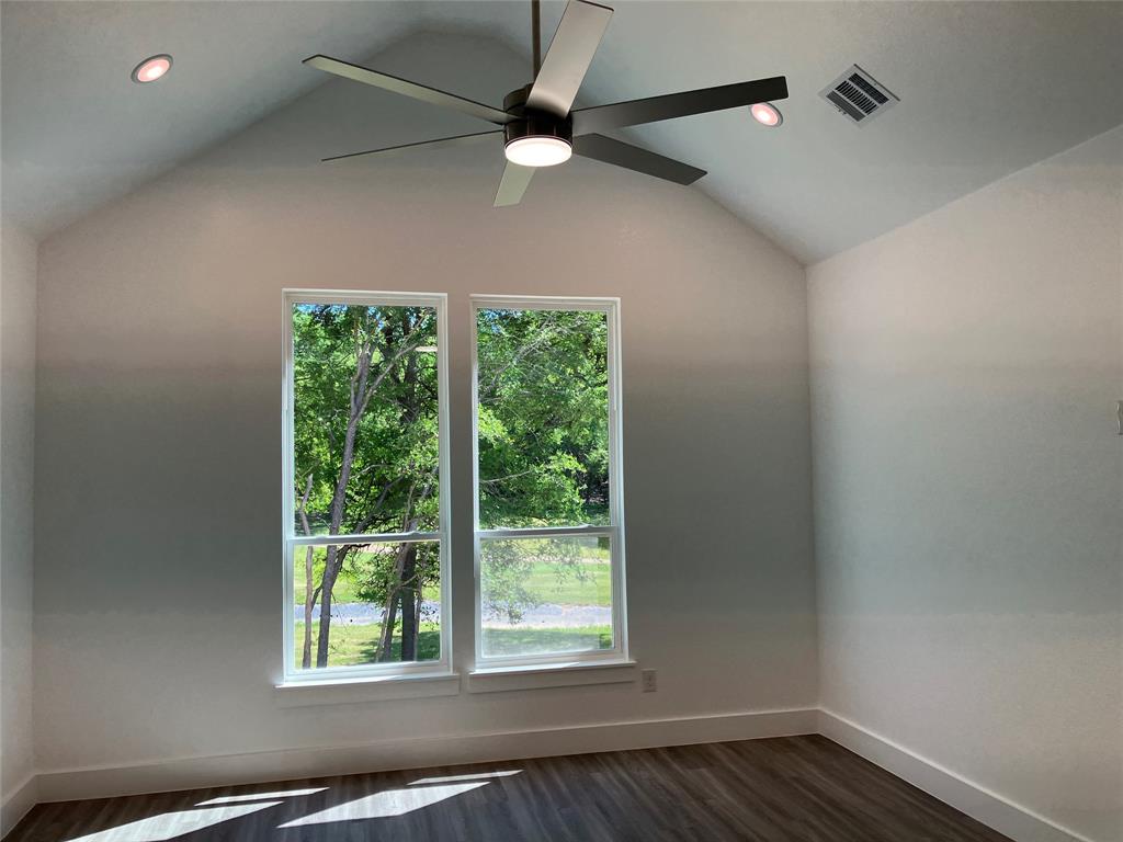 42101 Crooked Stick Drive Whitney, TX 76692 - Photo 20 of 27 a view of an empty room with wooden floor and a window