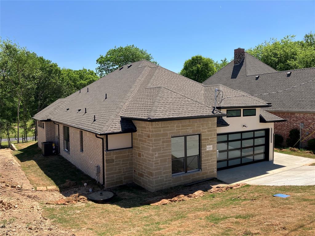 42101 Crooked Stick Drive Whitney, TX 76692 - Photo 22 of 27 a front view of a house with a yard
