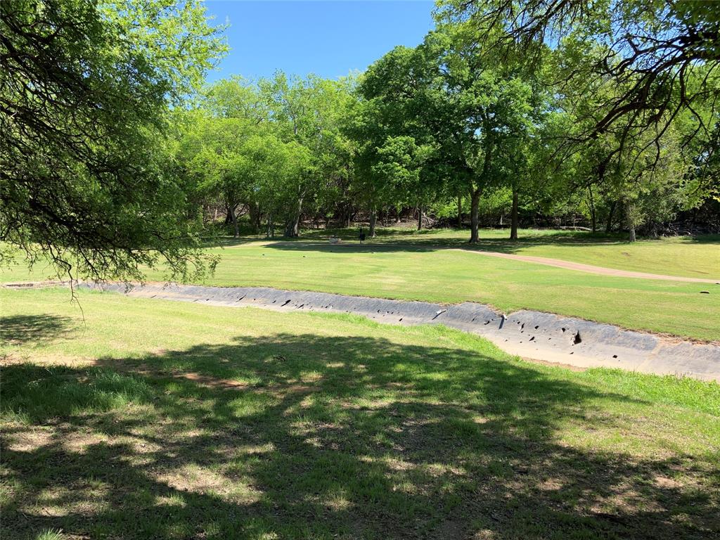 42101 Crooked Stick Drive Whitney, TX 76692 - Photo 27 of 27 a view of a swimming pool with an outdoor space and seating area