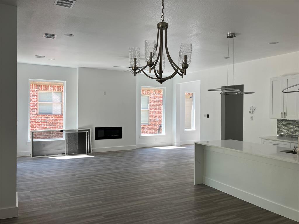 42101 Crooked Stick Drive Whitney, TX 76692 - Photo 7 of 27 a view of a livingroom with wooden floor and a fireplace