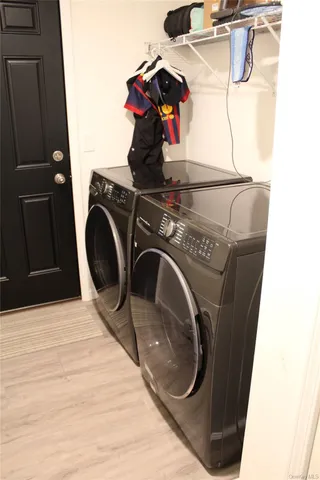 a utility room with dryer and washer