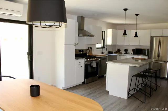 a kitchen with a sink appliances and cabinets