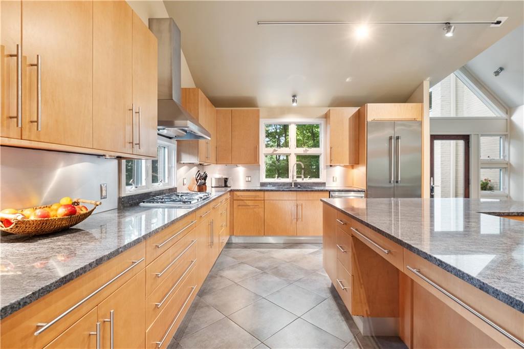 139 Witherow Road Sewickley, PA 15143 - Photo 14 of 41 a large kitchen with kitchen island granite countertop a large counter top and a sink