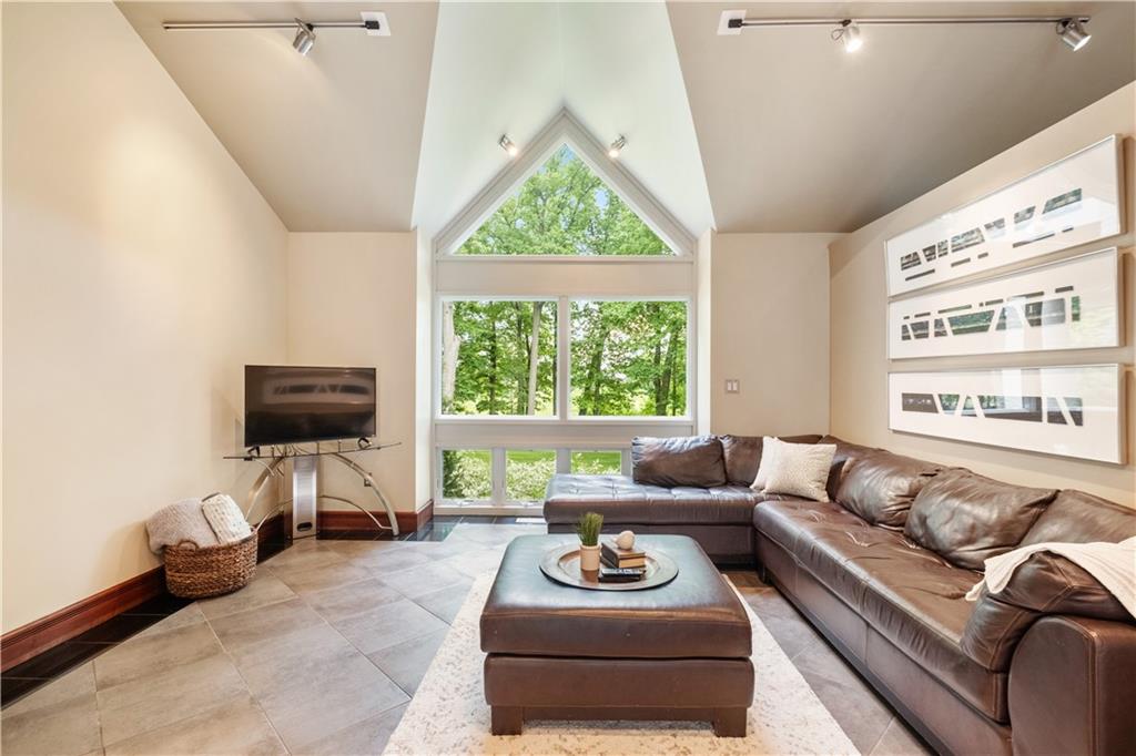 139 Witherow Road Sewickley, PA 15143 - Photo 16 of 41 a living room with furniture and a flat screen tv