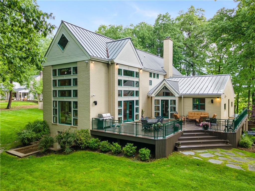 139 Witherow Road Sewickley, PA 15143 - Photo 2 of 41 a front view of a house with a yard table and chairs