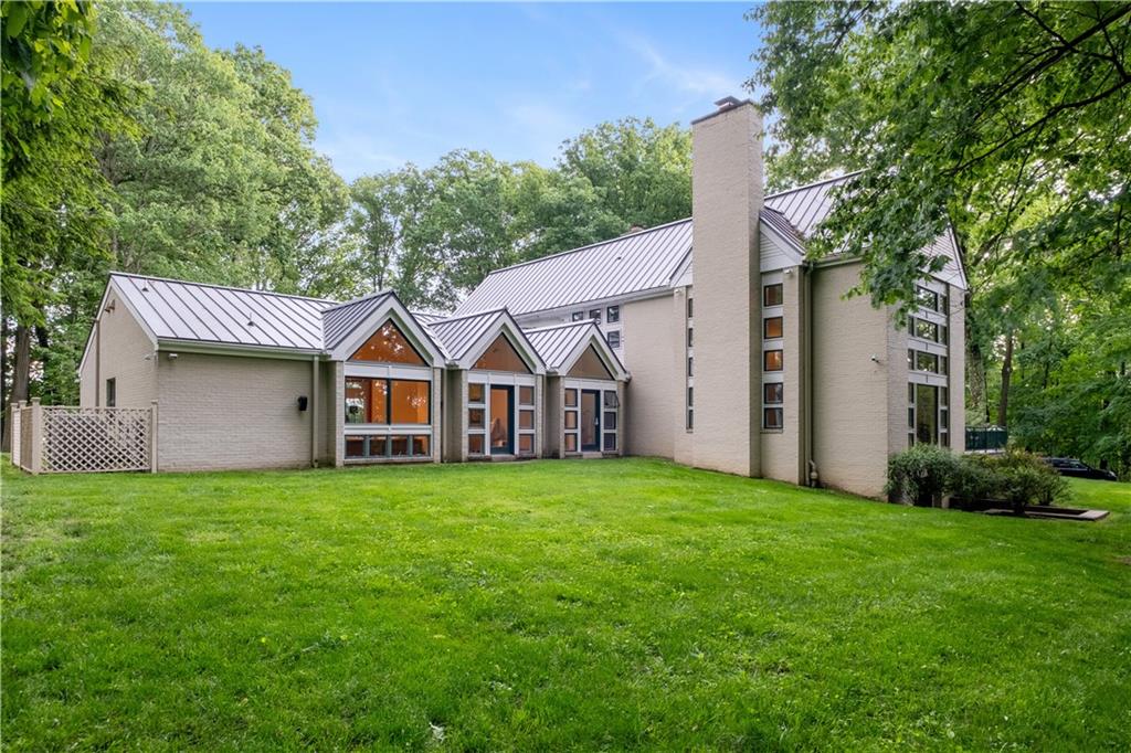 139 Witherow Road Sewickley, PA 15143 - Photo 37 of 41 a house that has a big yard with large trees