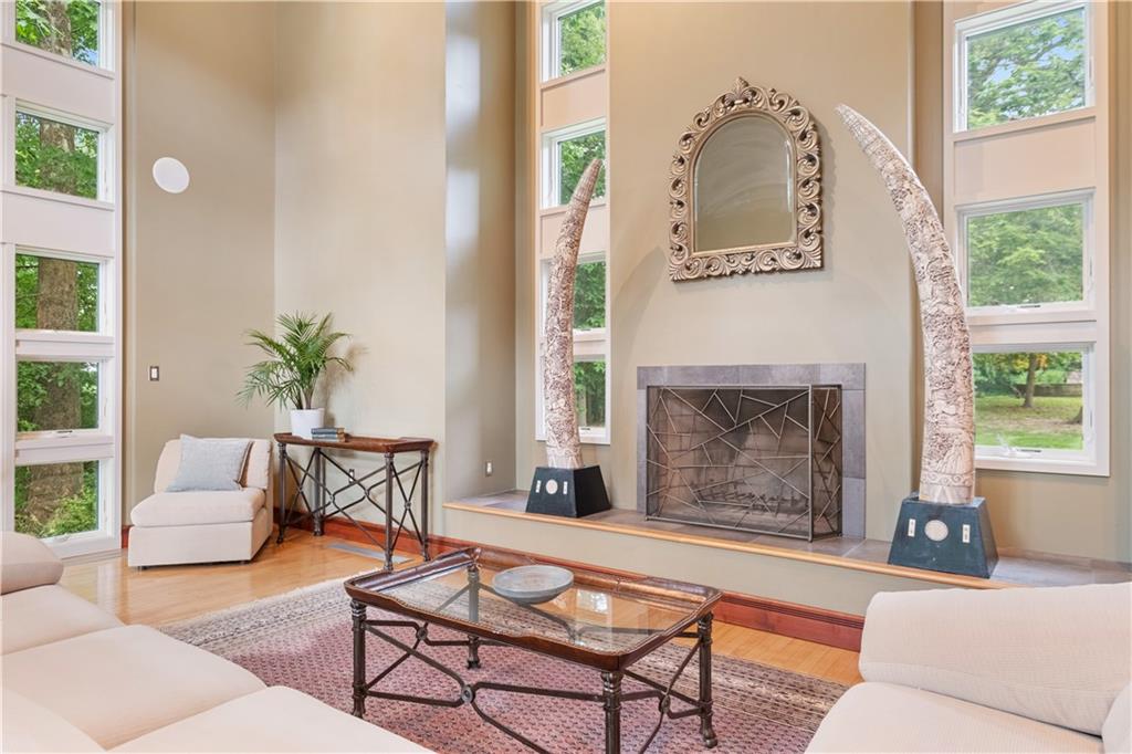139 Witherow Road Sewickley, PA 15143 - Photo 7 of 41 a living room with furniture and a fireplace