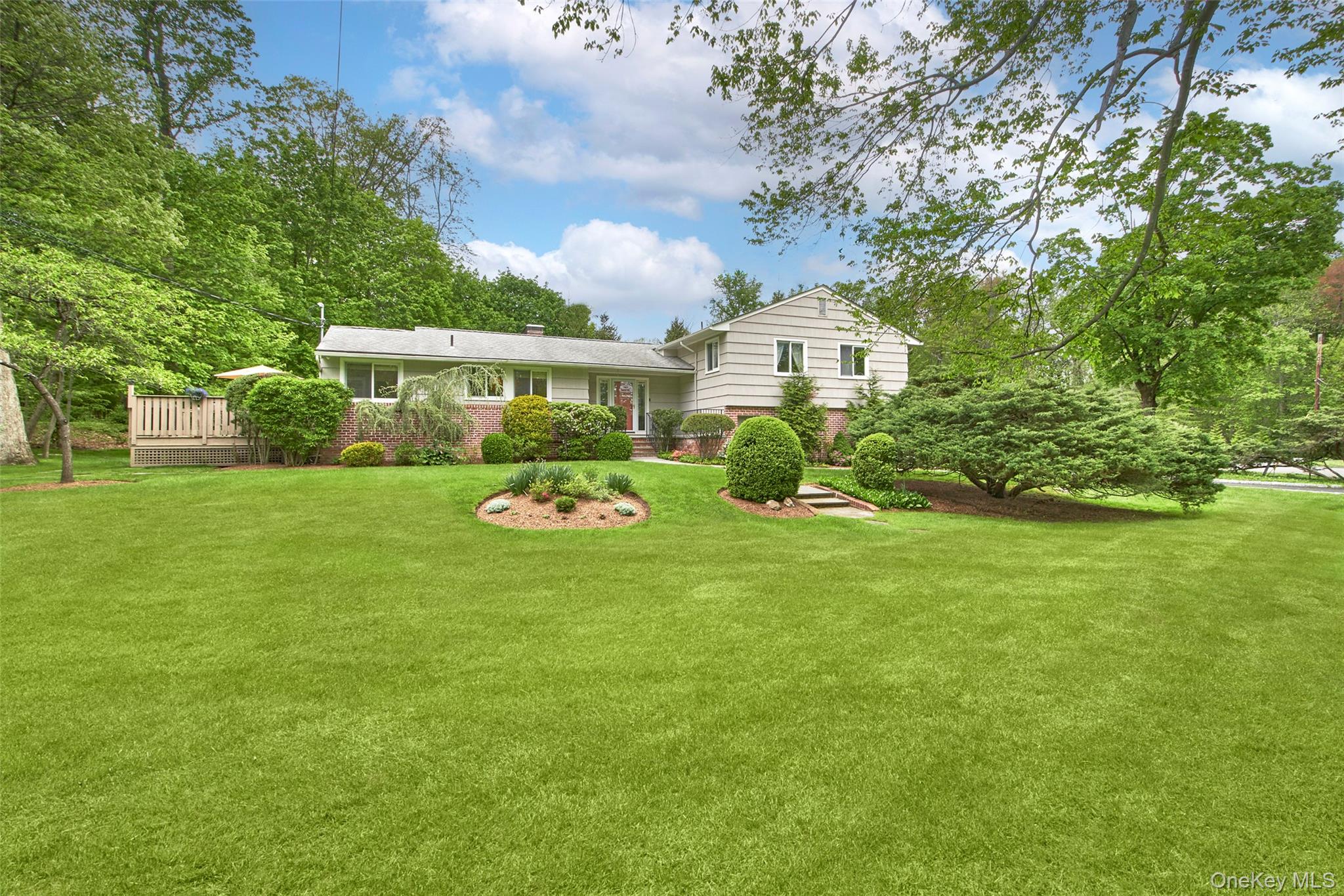 102 Butternut Road Briarcliff Manor, NY 10510 - Photo 1 of 1 a front view of a house with garden