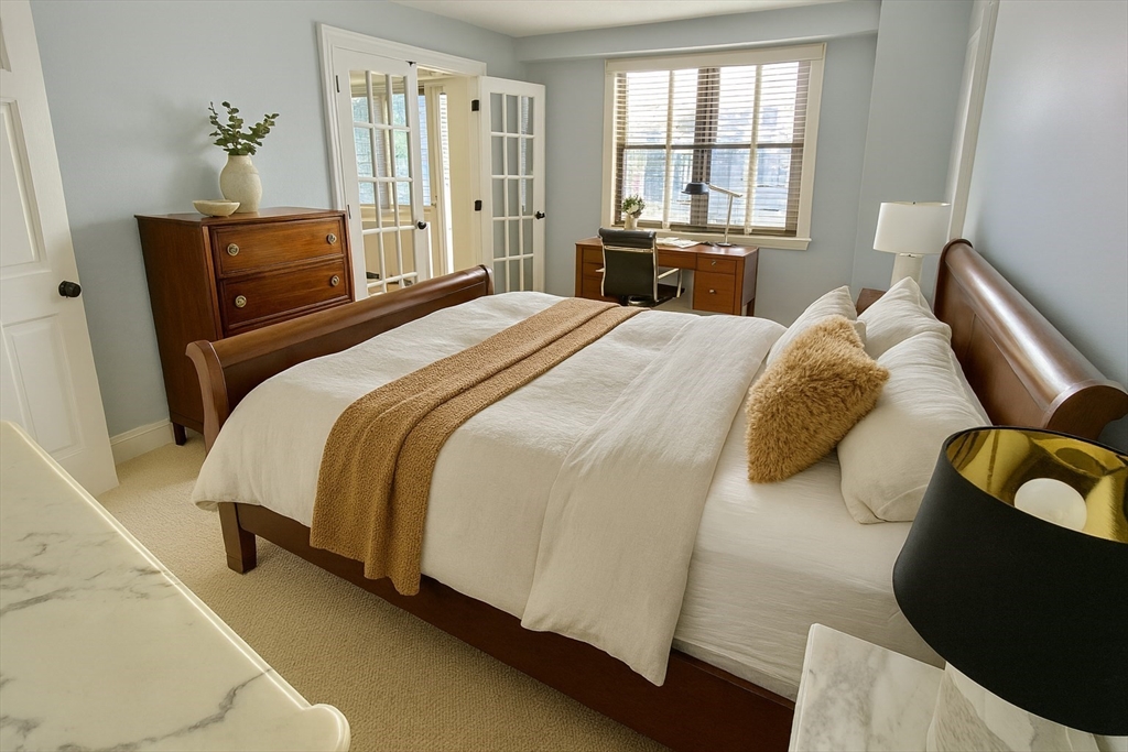 151 Tremont Street, Unit 24U Boston, MA 02111 - Photo 11 of 29 a bedroom with a bed and window