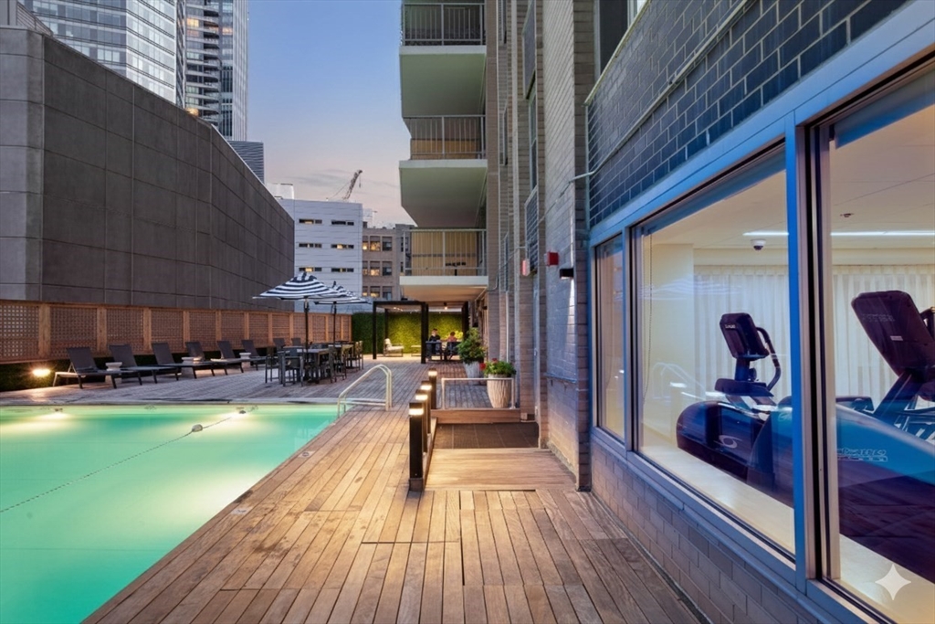 151 Tremont Street, Unit 24U Boston, MA 02111 - Photo 24 of 29 a view of a swimming pool with seating space