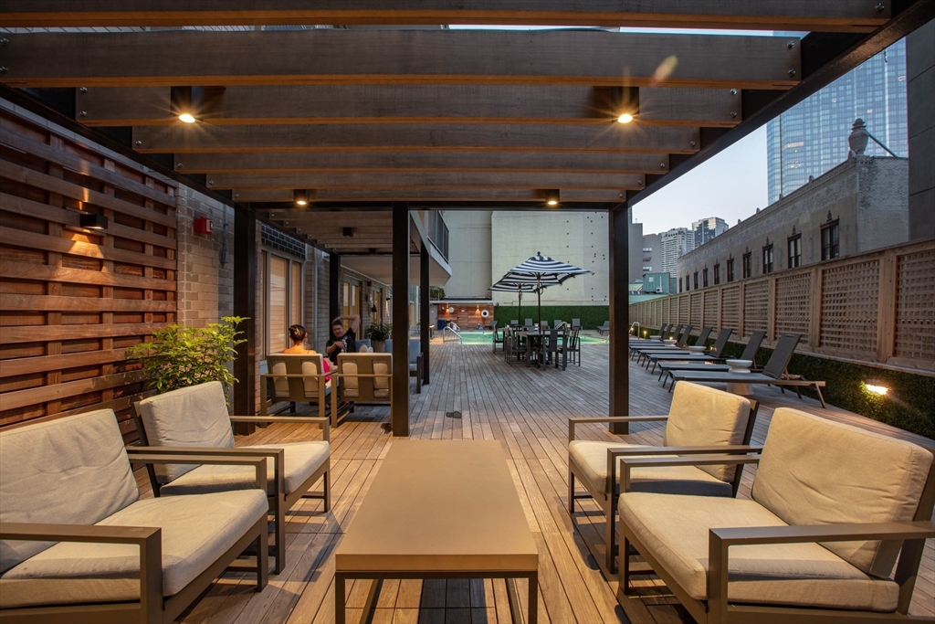 151 Tremont Street, Unit 24U Boston, MA 02111 - Photo 26 of 29 a outdoor space with patio lots of furniture