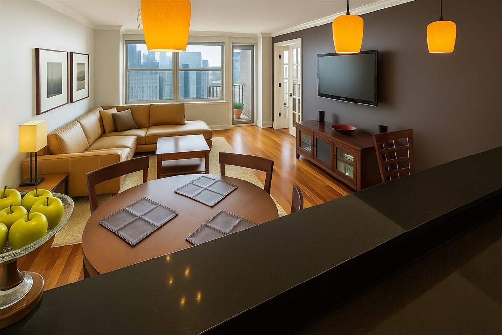 151 Tremont Street, Unit 24U Boston, MA 02111 - Photo 5 of 29 a living room with furniture and a flat screen tv