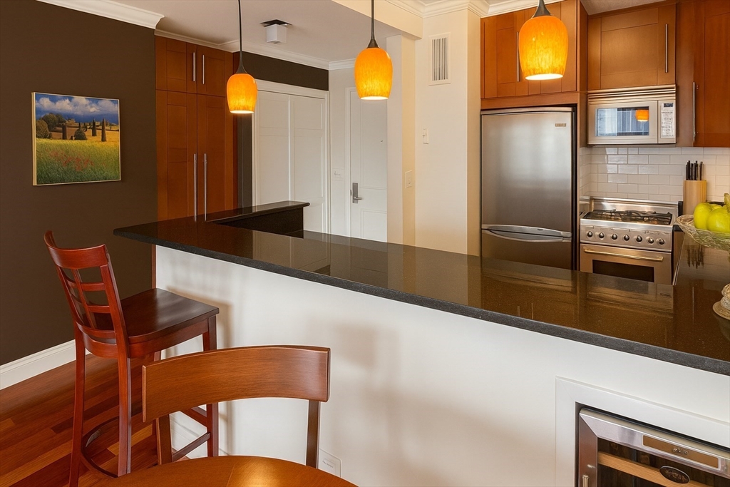 151 Tremont Street, Unit 24U Boston, MA 02111 - Photo 6 of 29 a view of a dining room with furniture and a window