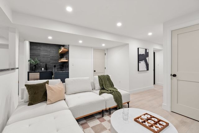 a living room with furniture and a rug