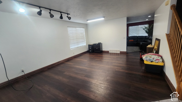 5948 Inheritance Court Taylorsville, UT 84123 - Photo 5 of 30 Wood-finish flooring, white wall finishes, and a window with blinds