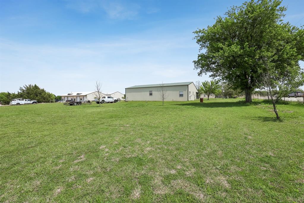 2011 Miller Road Melissa, TX 75454 - Photo 11 of 35 a view of an house with outdoor space and seating