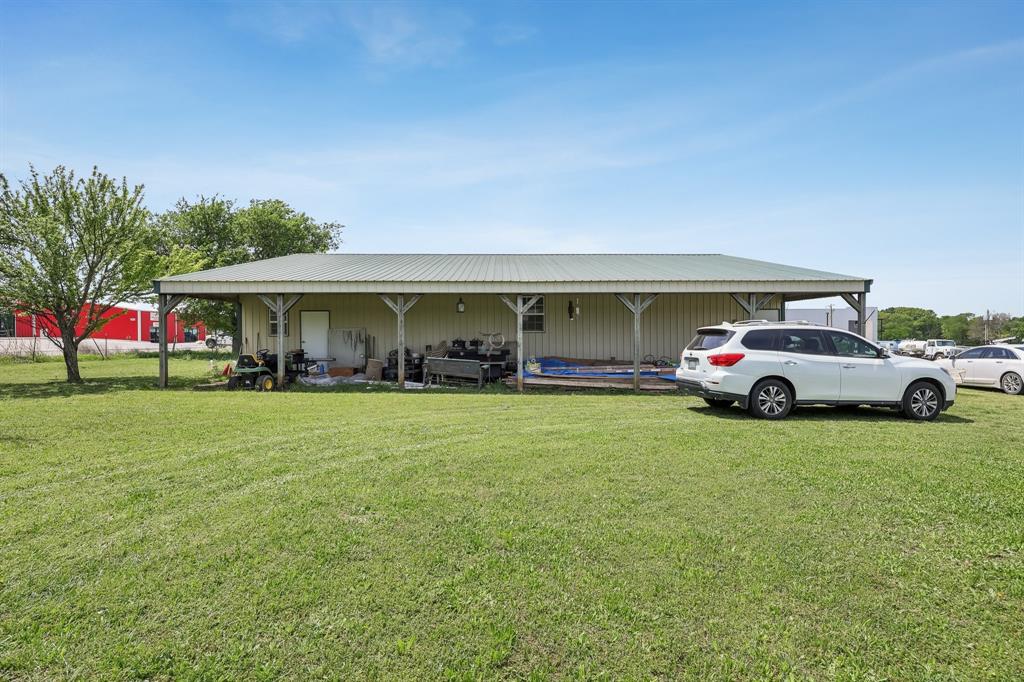 2011 Miller Road Melissa, TX 75454 - Photo 12 of 35 a view of a car parked in front of house with a yard