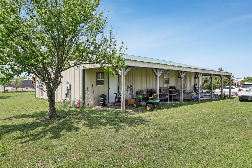 2011 Miller Road Melissa, TX 75454 - Photo 4 of 35 a view of a house with backyard porch and garden