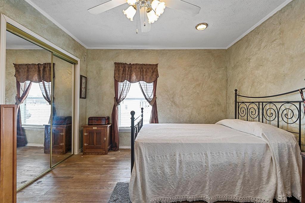 2011 Miller Road Melissa, TX 75454 - Photo 5 of 35 a bedroom with a bed and a mirror