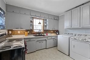 2011 Miller Road Melissa, TX 75454 - Photo 7 of 35 a kitchen with a sink stove and cabinets