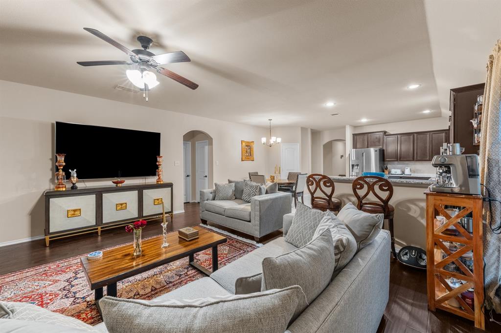 201 Whitman Drive McKinney, TX 75072 - Photo 18 of 33 a living room with furniture and a flat screen tv