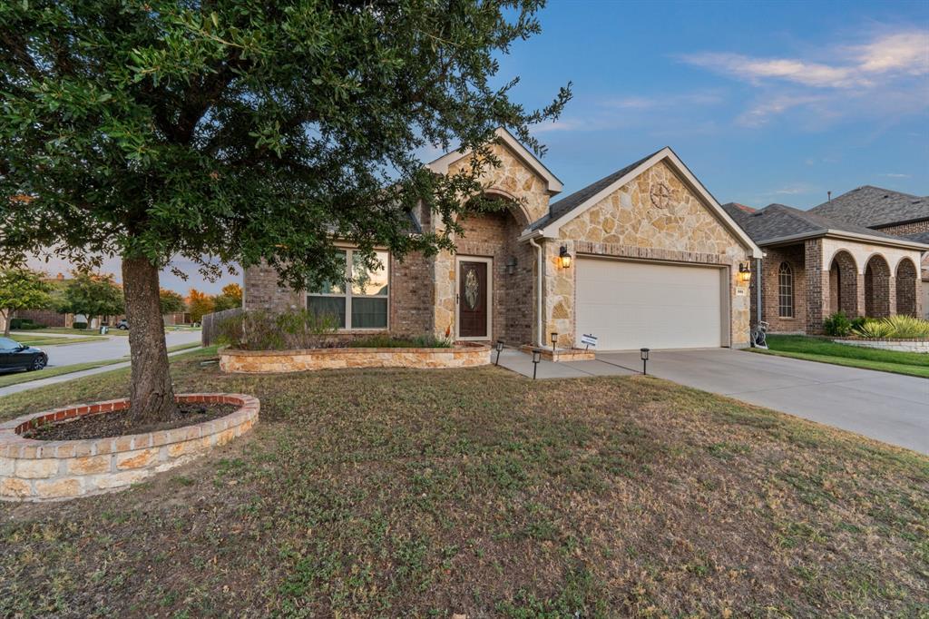 201 Whitman Drive McKinney, TX 75072 - Photo 2 of 33 a view of a house with backyard and trees