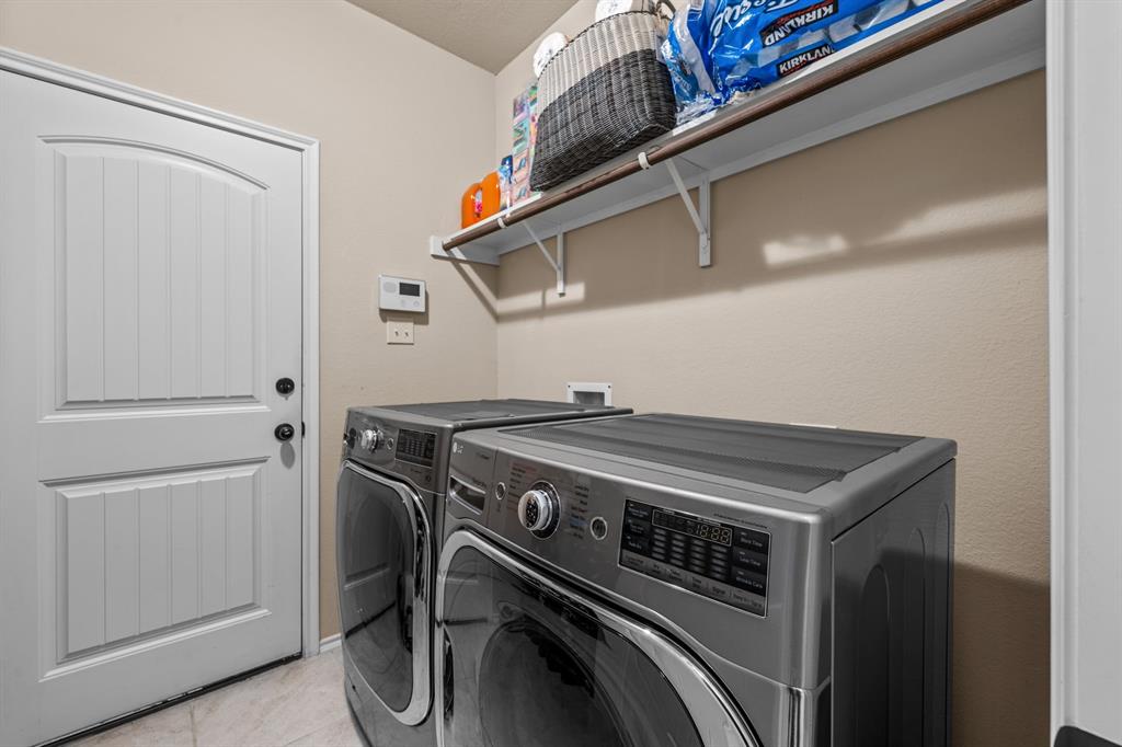 201 Whitman Drive McKinney, TX 75072 - Photo 29 of 33 a utility room with dryer and washer