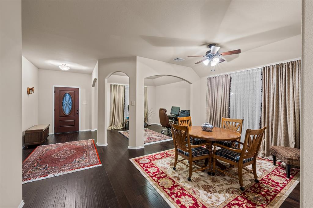 201 Whitman Drive McKinney, TX 75072 - Photo 30 of 33 a view of a dining room with furniture and wooden floor
