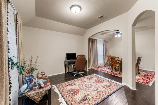 a living room with furniture and a rug
