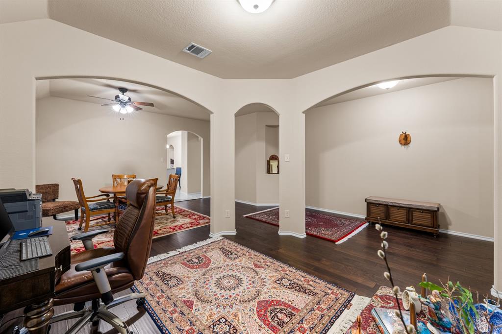 201 Whitman Drive McKinney, TX 75072 - Photo 7 of 33 a living room with furniture and a wooden floor