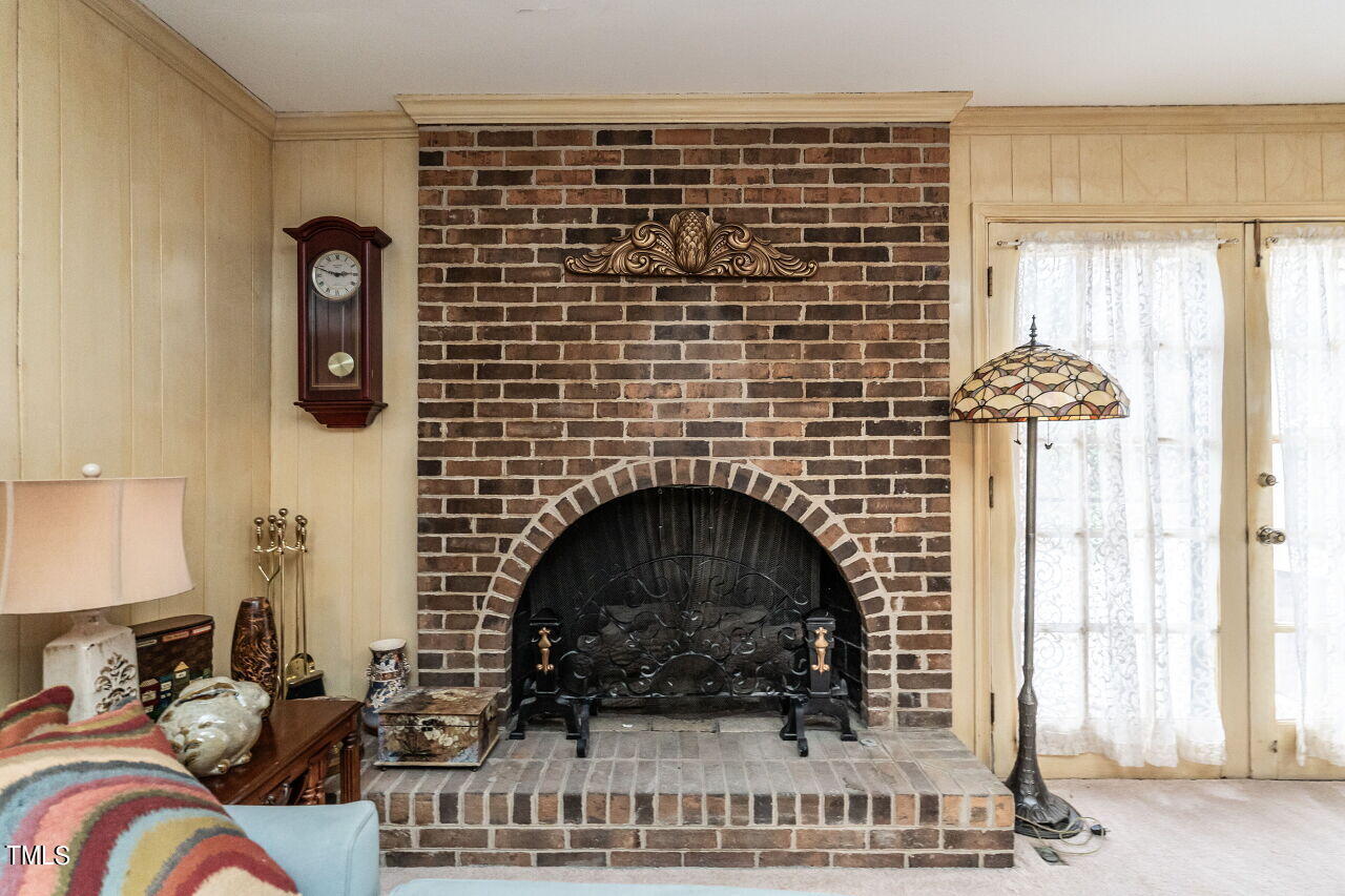 609 Queensferry Road Cary, NC 27511 - Photo 5 of 12 a living room with furniture and a fireplace