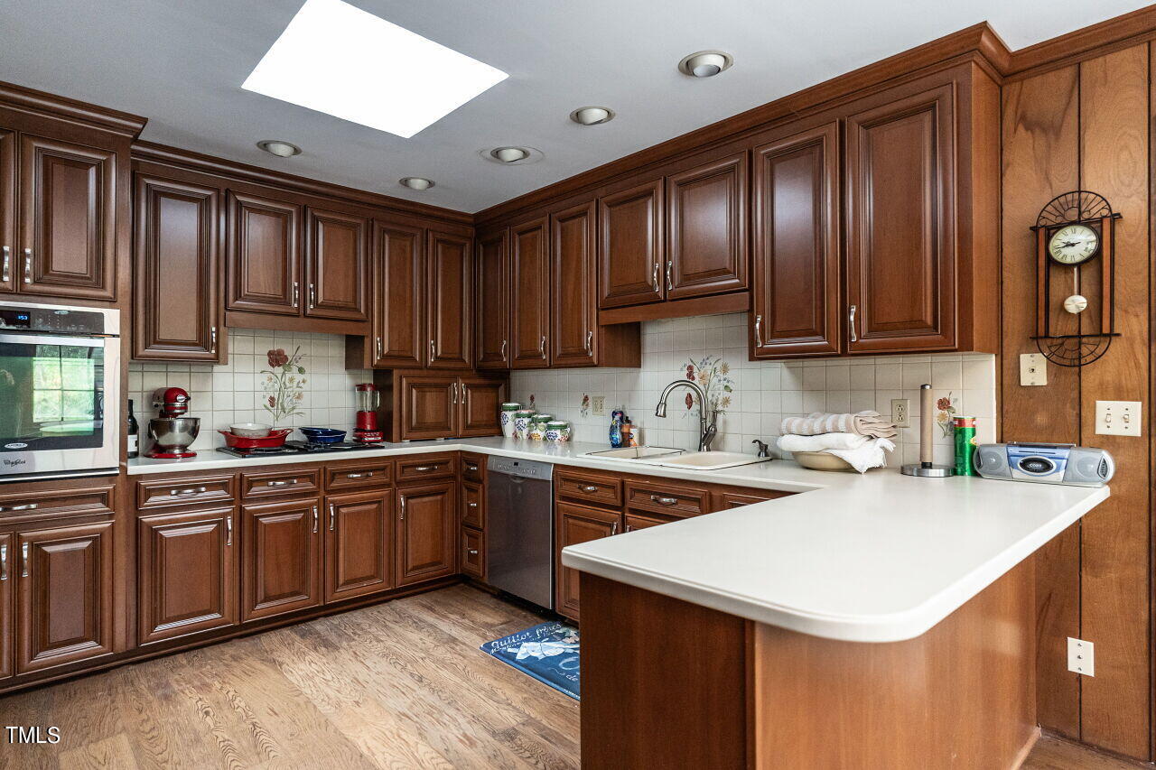 609 Queensferry Road Cary, NC 27511 - Photo 6 of 12 a kitchen with a sink cabinets and window