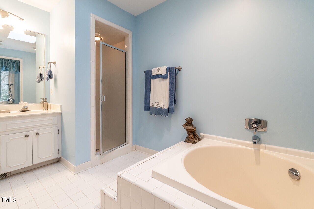 609 Queensferry Road Cary, NC 27511 - Photo 9 of 12 a bathroom with a sink and a mirror