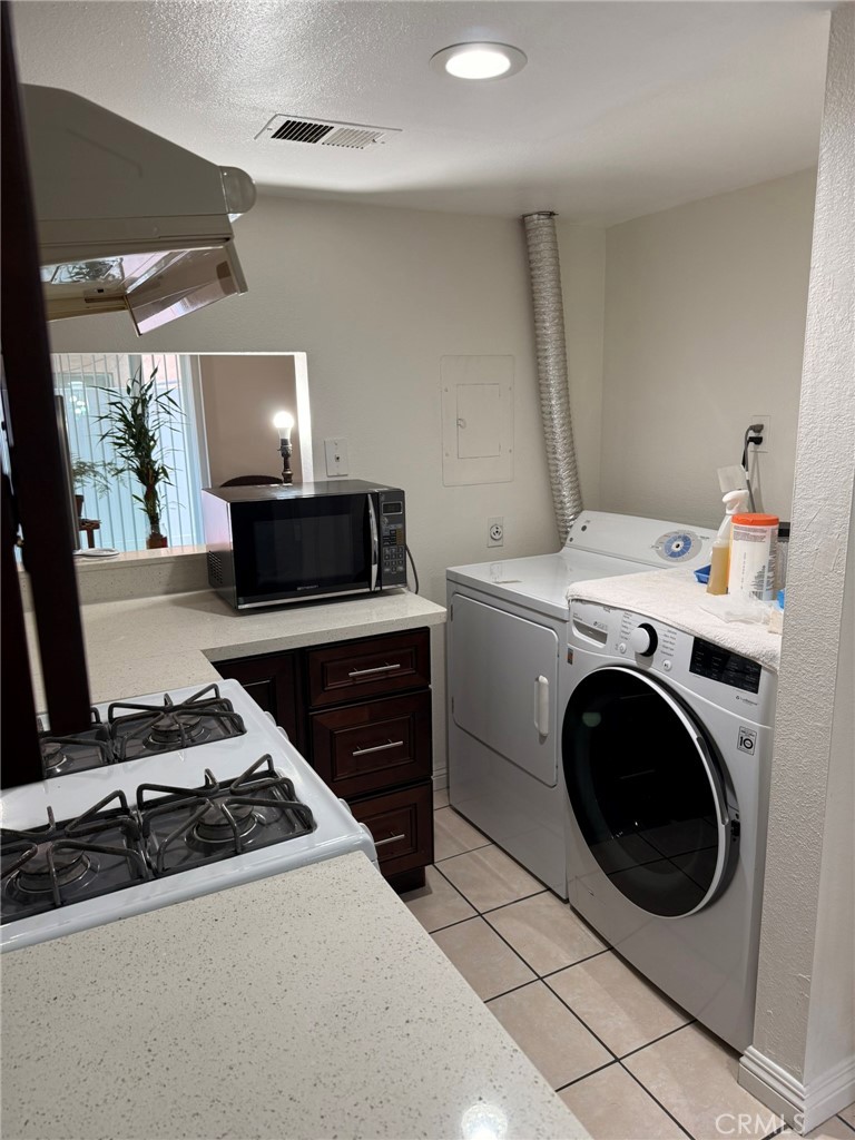 11829 Ferris Road, Unit E El Monte, CA 91732 - Photo 9 of 10 a utility room with sink dryer and washer