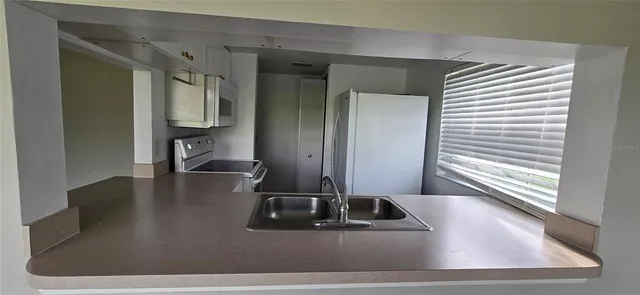 a view of a hallway with a couch