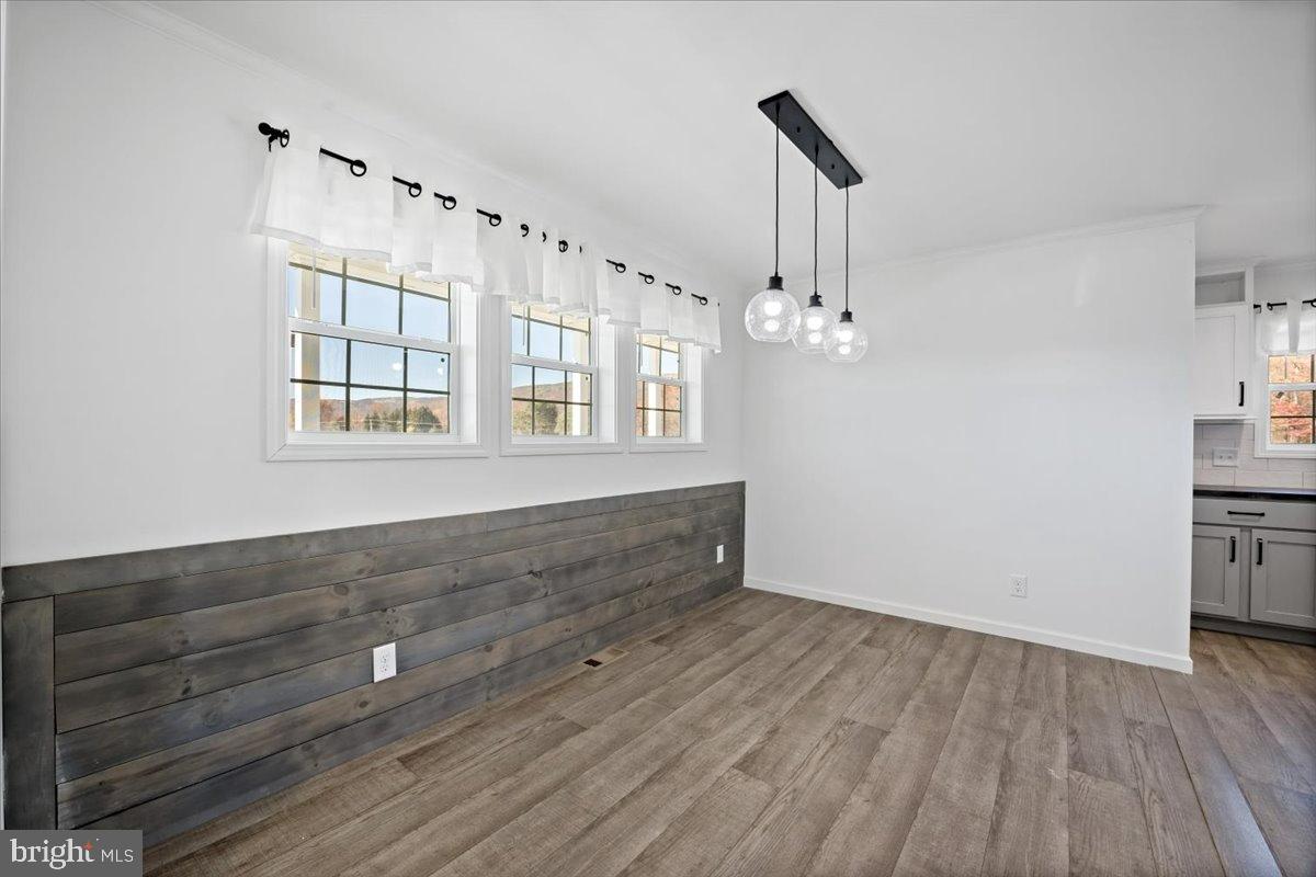1412 Heytesbury Road Walnutport, PA 18088 - Photo 11 of 39 wooden floor in an empty room with a window