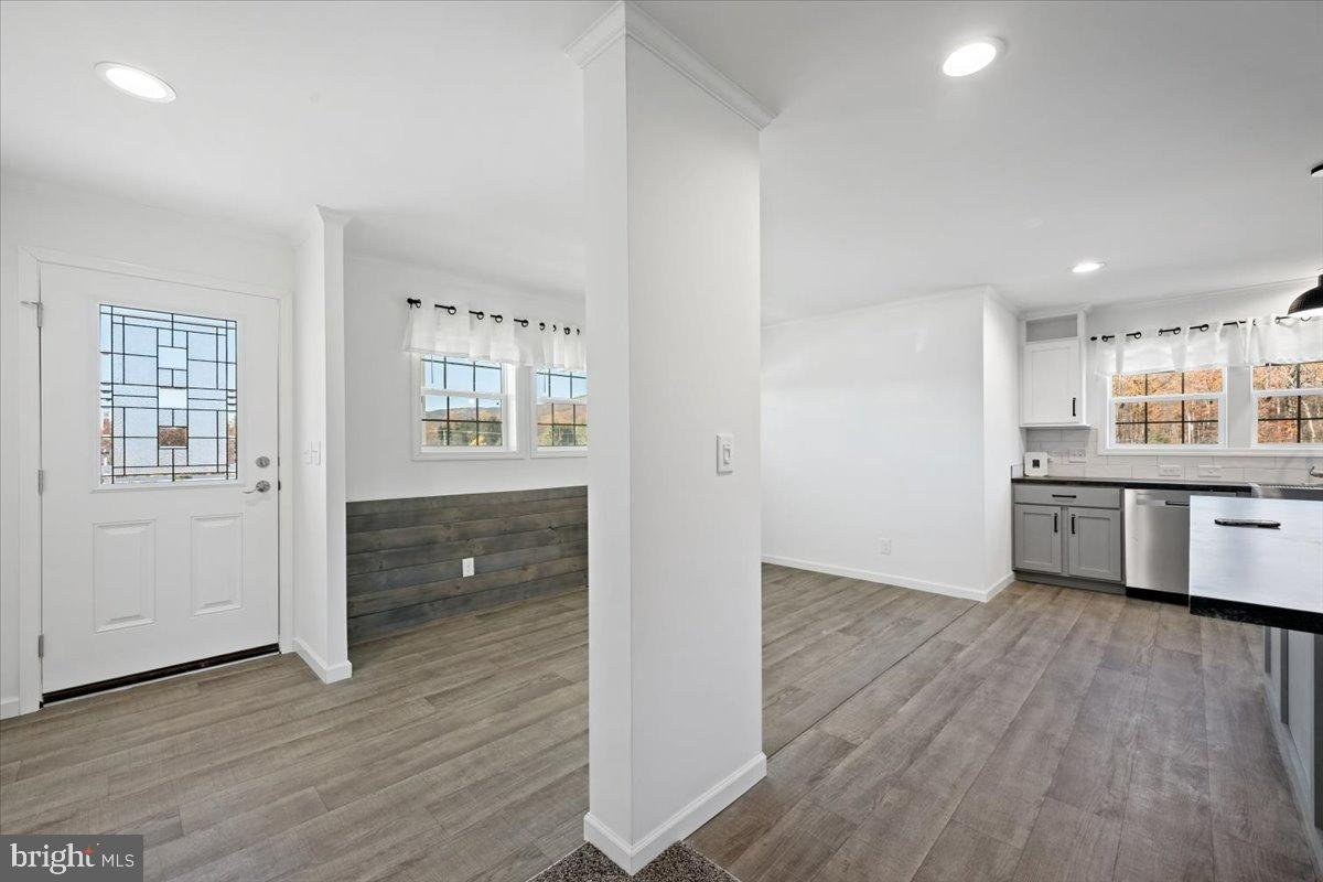 1412 Heytesbury Road Walnutport, PA 18088 - Photo 13 of 39 an empty room with wooden floor and windows