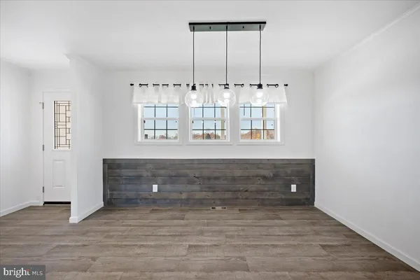 a view of room with window and cabinet