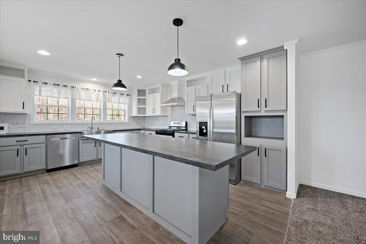 1412 Heytesbury Road Walnutport, PA 18088 - Photo 18 of 39 a kitchen with stainless steel appliances granite countertop a sink stove and refrigerator