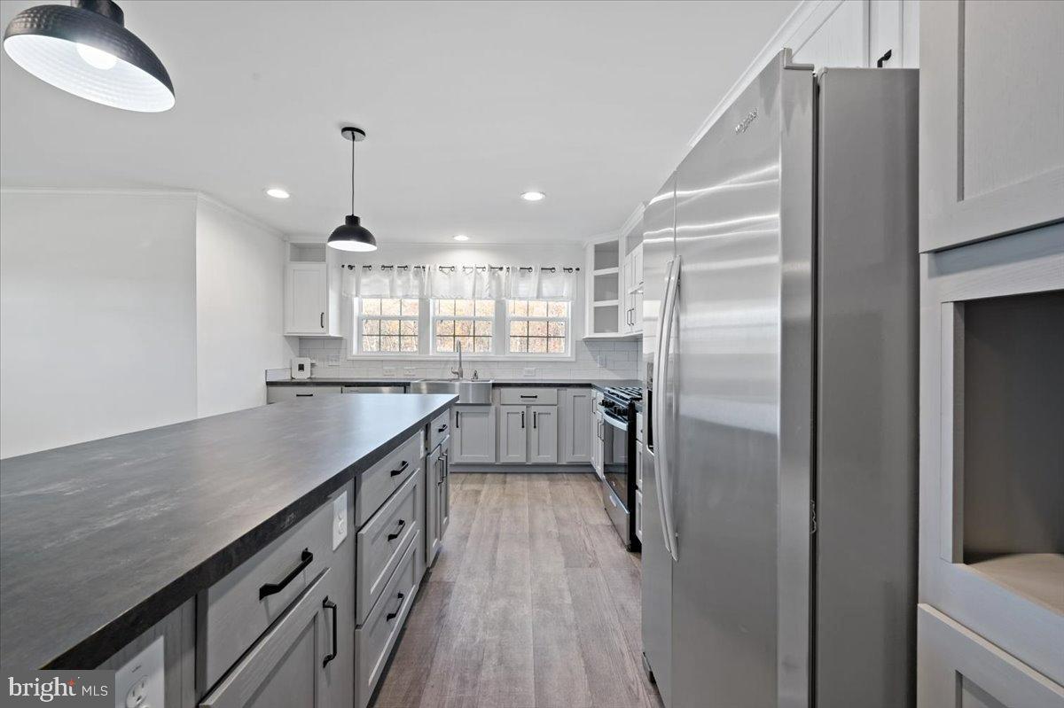 1412 Heytesbury Road Walnutport, PA 18088 - Photo 20 of 39 a kitchen with stainless steel appliances granite countertop a refrigerator a sink and a stove