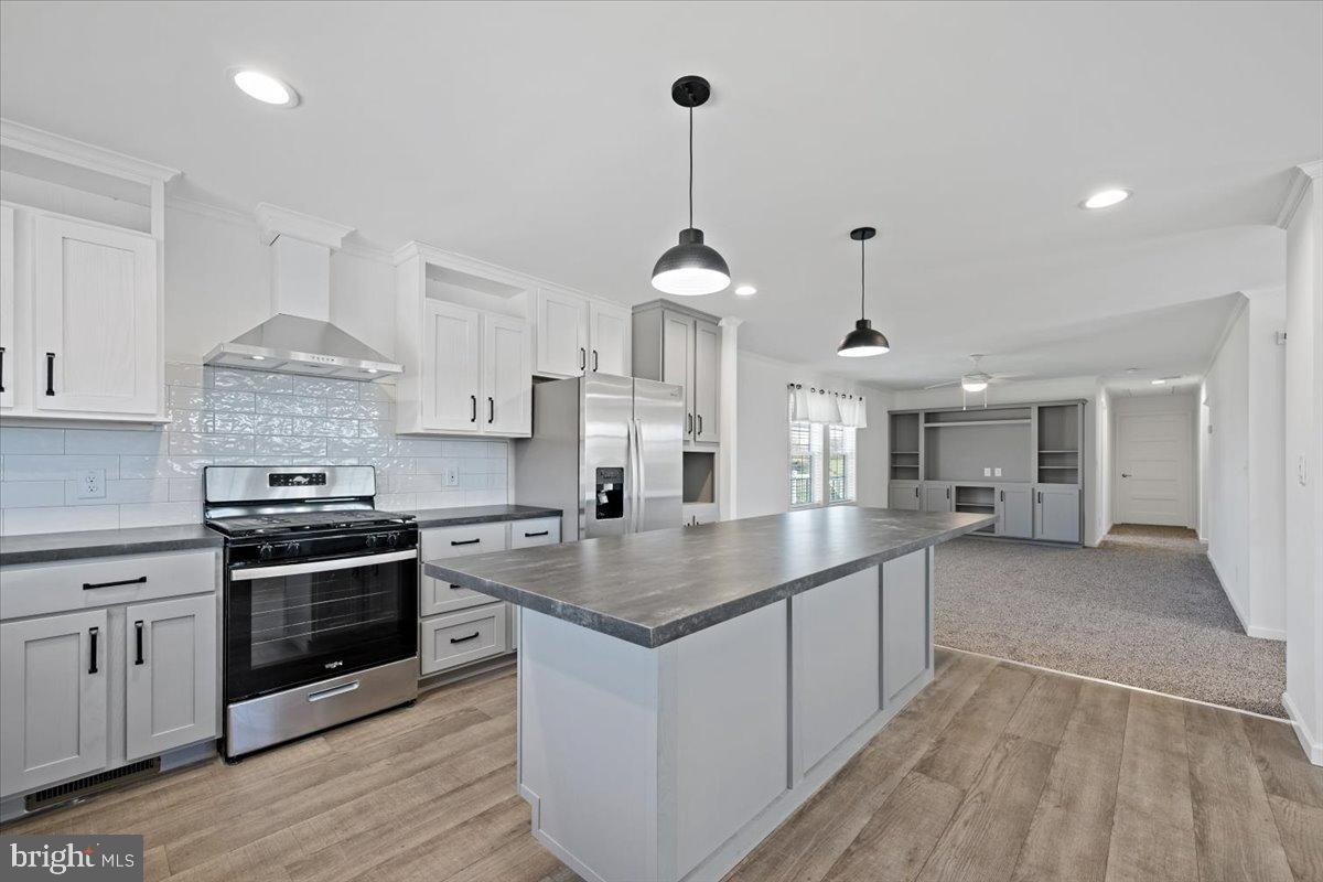 1412 Heytesbury Road Walnutport, PA 18088 - Photo 22 of 39 a kitchen with stainless steel appliances granite countertop a stove and a sink