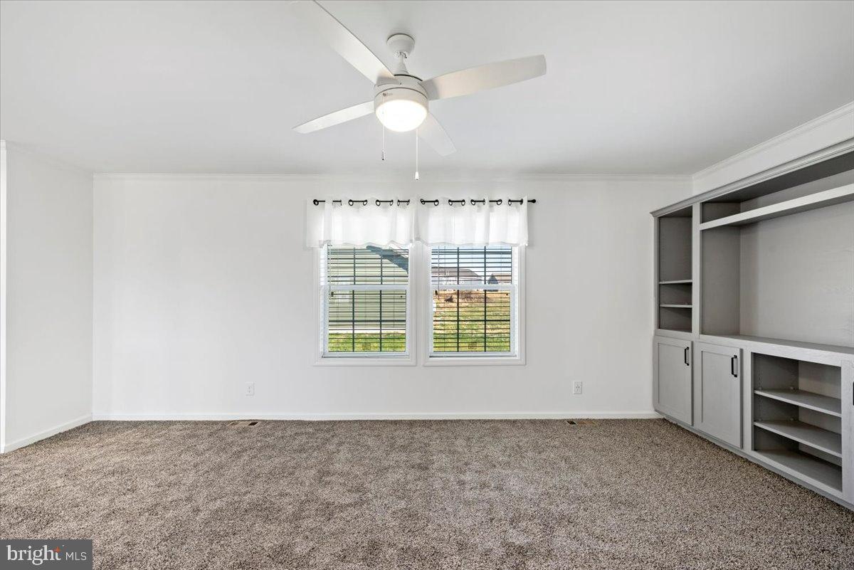 1412 Heytesbury Road Walnutport, PA 18088 - Photo 27 of 39 an empty room with windows and ceiling fan