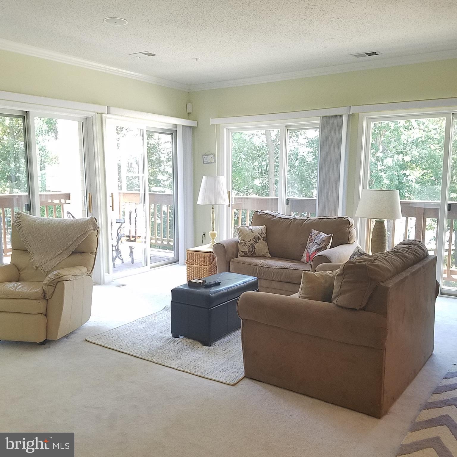 526 Runabout Loop Solomons, MD 20688 - Photo 4 of 33 Double set of patio doors -lots of light and air
