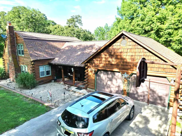 a view of backyard with a patio and a garden