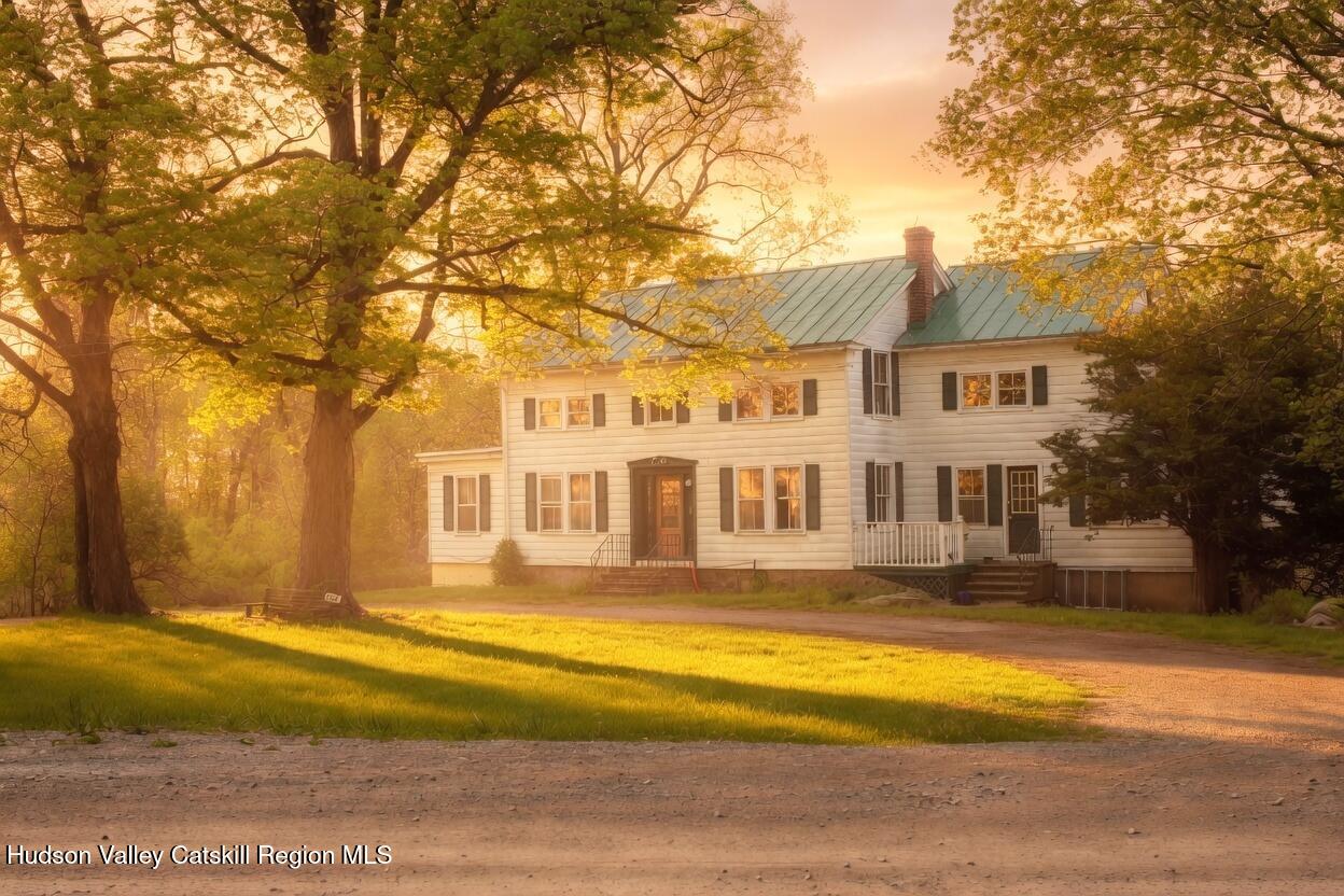 139 Haddock Hill Road Old Chatham, NY 12136 - Photo 1 of 18 a front view of a house with a big yard