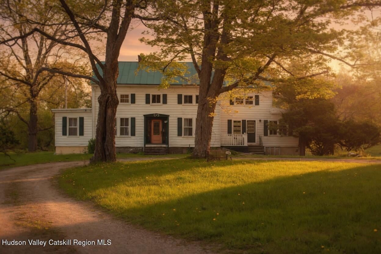 139 Haddock Hill Road Old Chatham, NY 12136 - Photo 2 of 18 a front view of a house with a yard