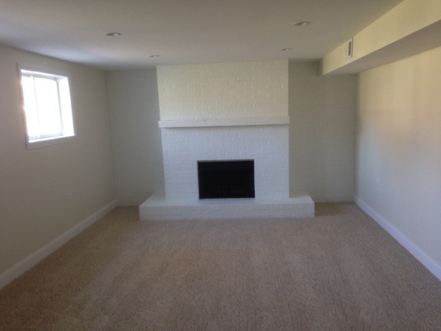 193 South Pinecrest Road Bolingbrook, IL 60440 - Photo 14 of 21 an empty room with a fireplace